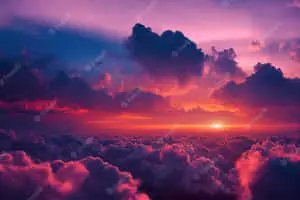 sunset over clouds with purple sky