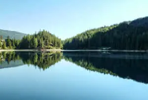 A picture-perfect view of a snow-capped mountain lake 