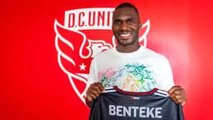 Christian Benteke Holding Black Jersey