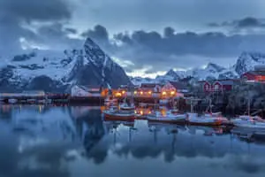 Hamnøy Village nestled amidst majestic snowy mountains