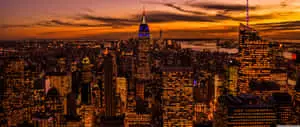 a cityscape at sunset with a city in the background