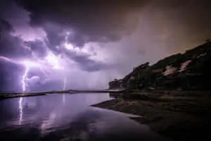 Light Purple Lightning Over Water