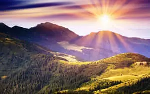 Sun Rise Over Mountainous Landscape