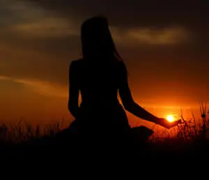 A vibrant sunset silhouette against a breathtaking sky